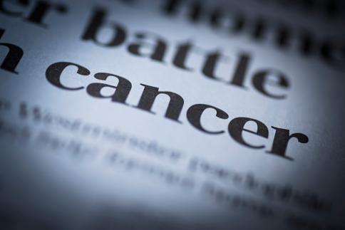 cancer written in a newspaper